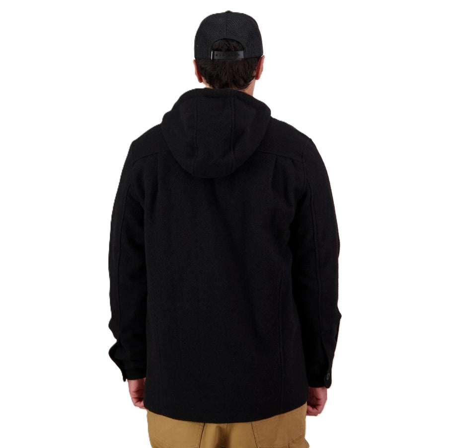 Person wearing a black jacket and cap on a white background
