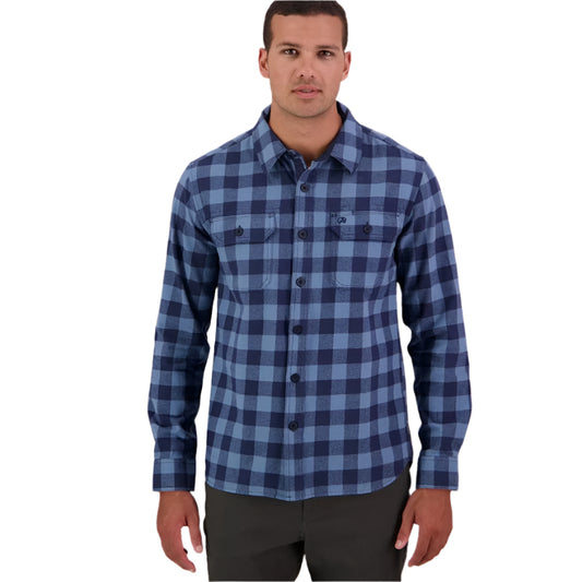 A man wearing a Swanndri men's Taranaki Tailor long-sleeved shirt in blue and navy check.