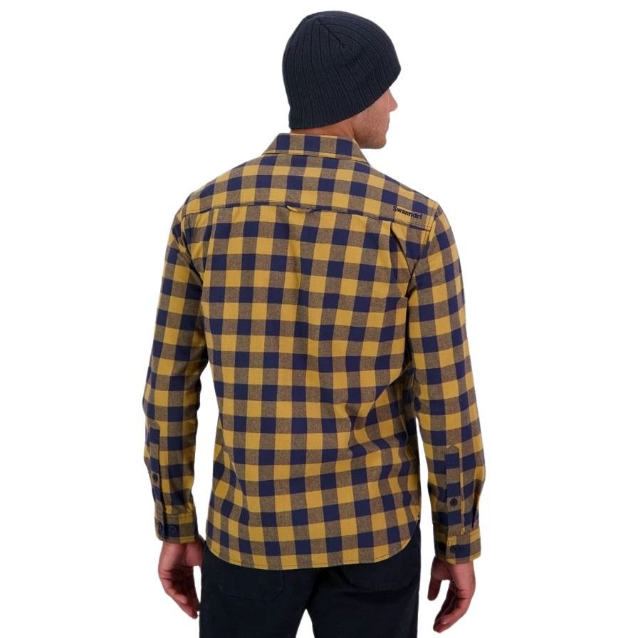 Person wearing a yellow and blue plaid shirt on a white background