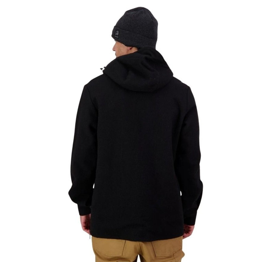 Person wearing a black hoodie and beanie on a white background