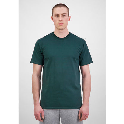 Man wearing a dark green t-shirt and gray pants on a white background