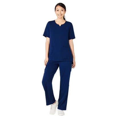 Woman wearing a navy blue scrub set against a plain background