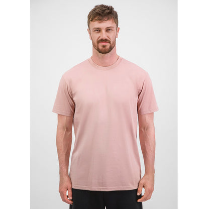 Man wearing a light pink t-shirt against a white background