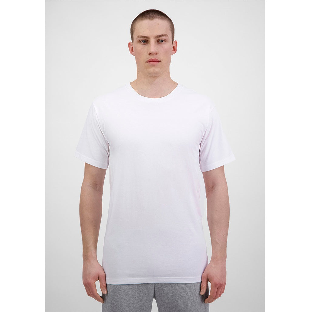 Person wearing a plain white t-shirt and gray pants on a light gray background