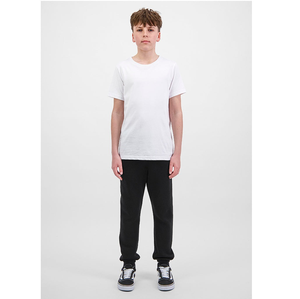 Person wearing a white t-shirt and black pants on a plain background