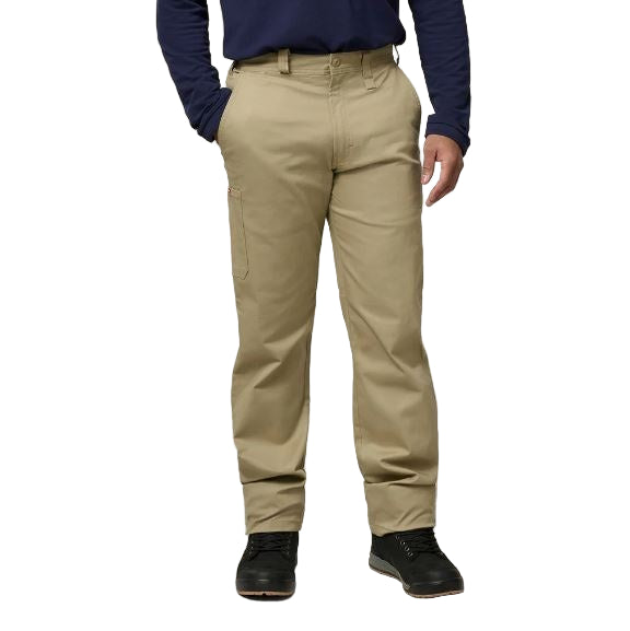 Person wearing beige pants and a navy shirt on a plain background
