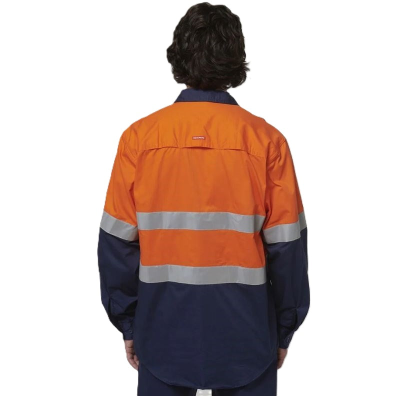 Person wearing an orange and navy high-visibility work jacket on a white background