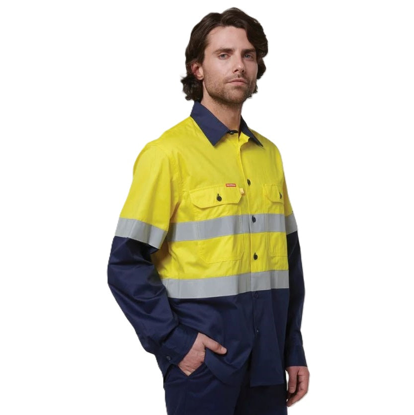 Person wearing a high-visibility yellow and navy work shirt on a white background