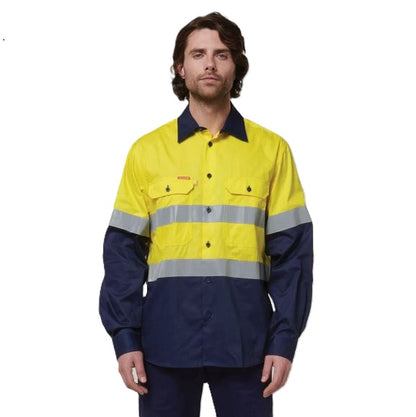 Person wearing a high-visibility yellow and navy work shirt on a white background