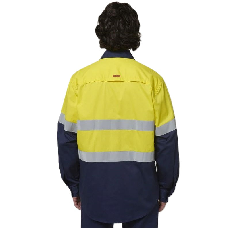 Person wearing a high-visibility jacket with reflective stripes on a white background