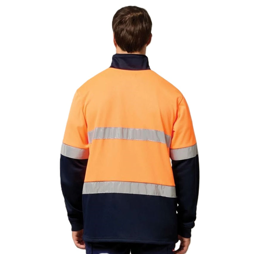 Person wearing a high-visibility orange and navy jacket with reflective stripes on a white background