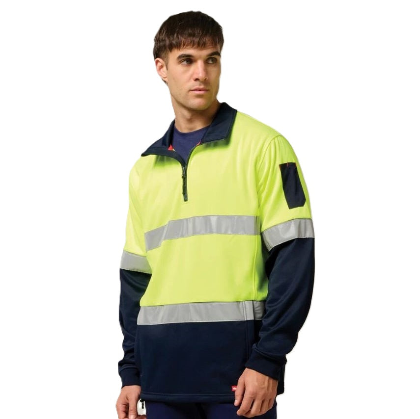 Person wearing a high-visibility safety jacket with reflective stripes on a white background