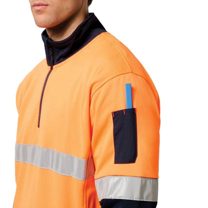Orange safety jacket with reflective strip and blue pen pocket on a white background