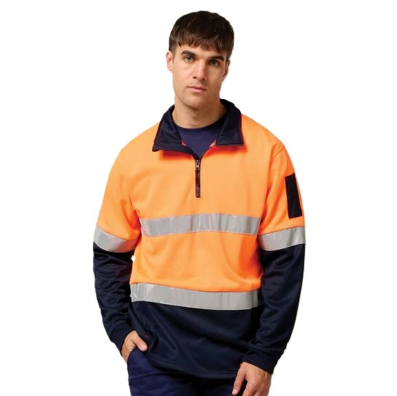 Person wearing an orange and navy high-visibility work jacket on a white background