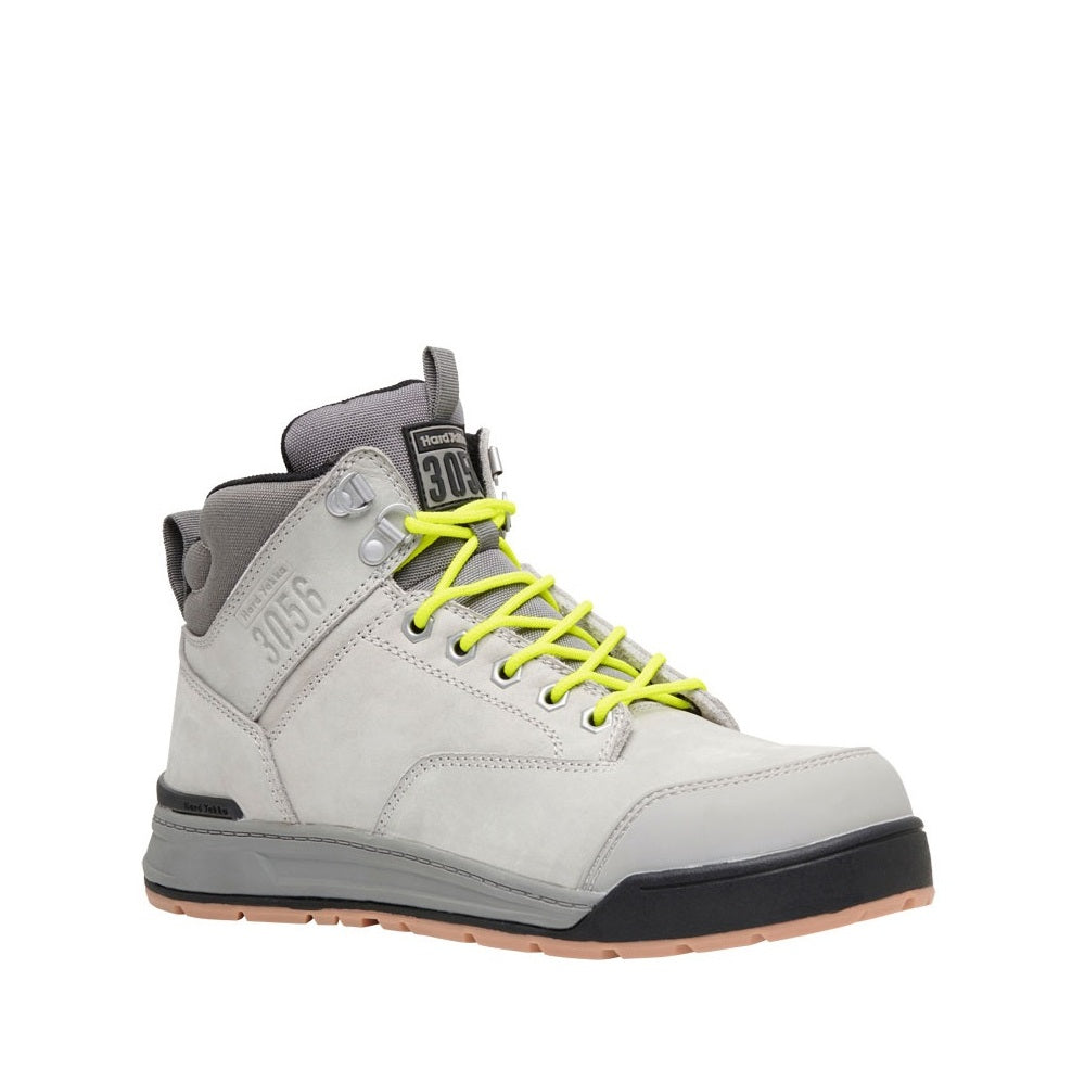 Gray high-top sneaker with neon yellow laces on a white background