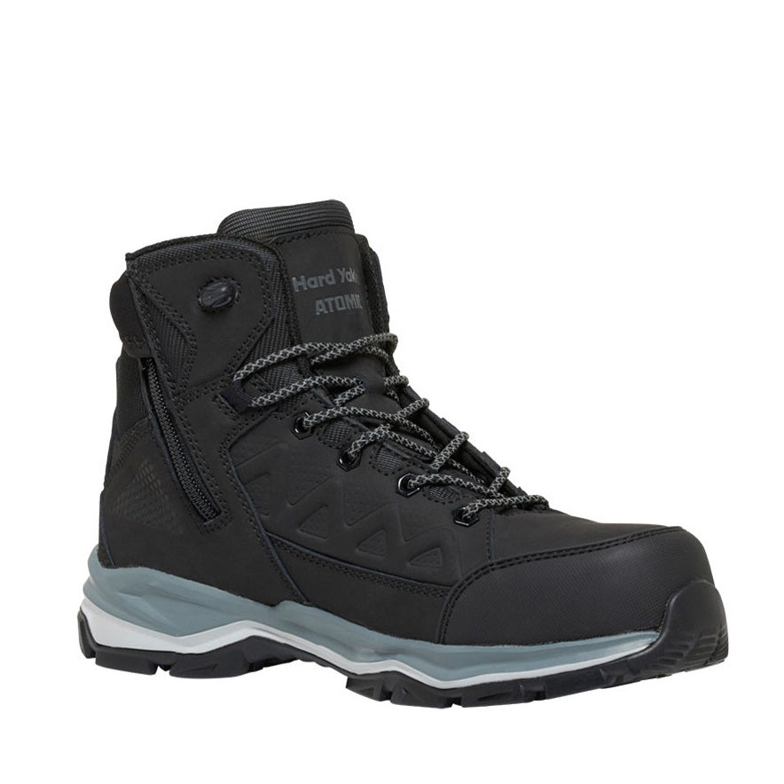 Black hiking boot with a white sole on a white background