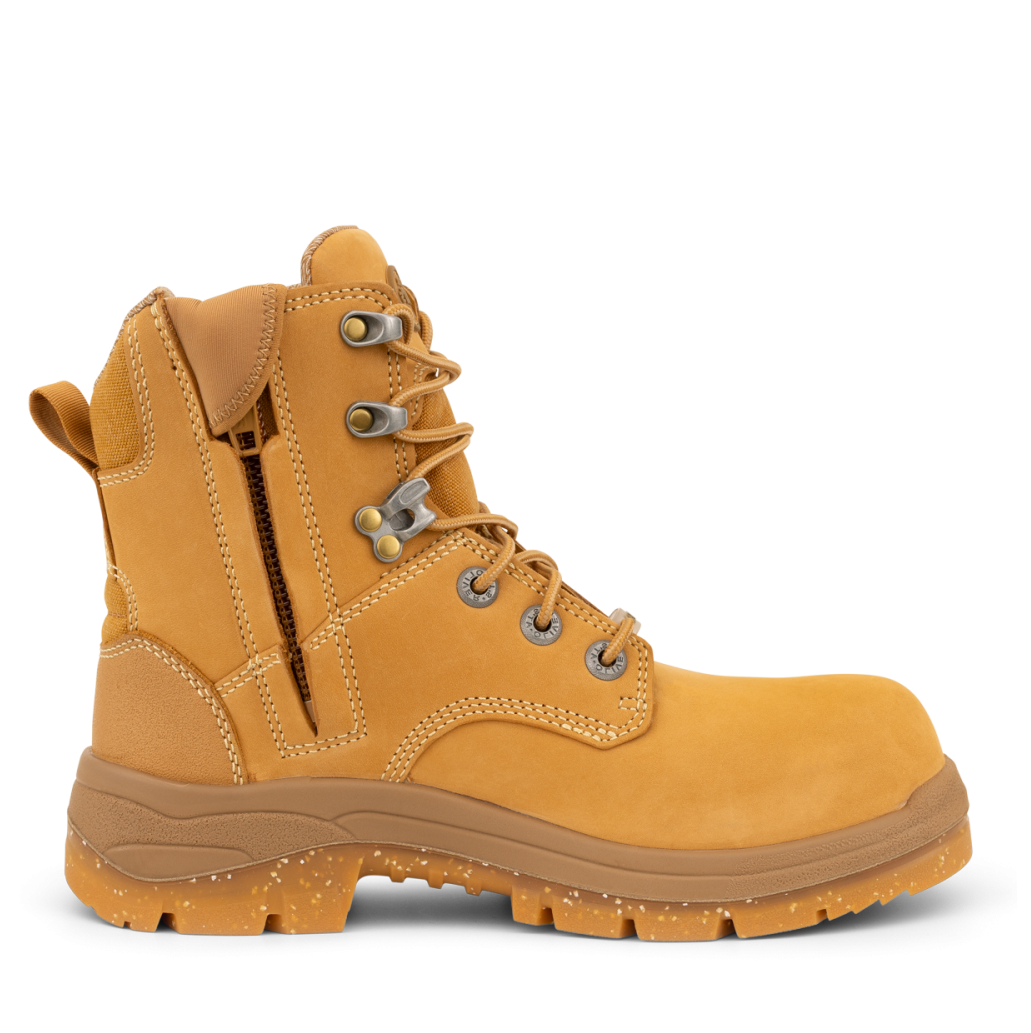 Yellow work boot with brown sole on a white background