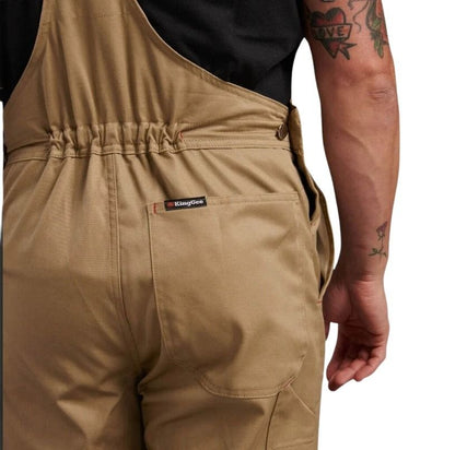 Tan overalls with a visible brand logo on a white background