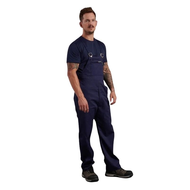 Man wearing navy blue work jumpsuit on a white background