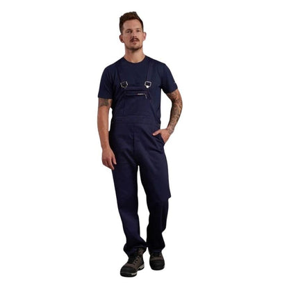 Man wearing navy blue work overalls on a white background