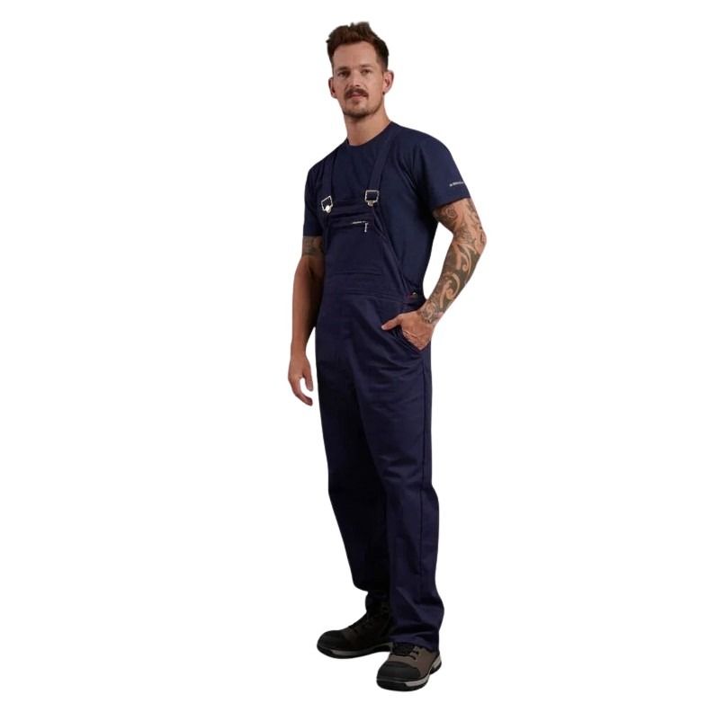 Man wearing a navy blue jumpsuit on a white background
