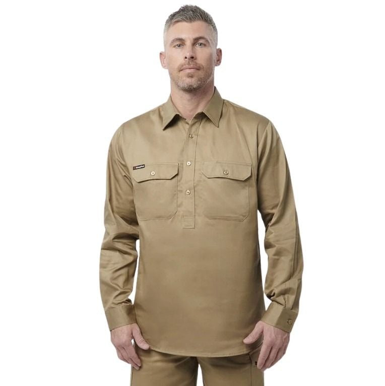 Man wearing a tan long-sleeve shirt on a white background