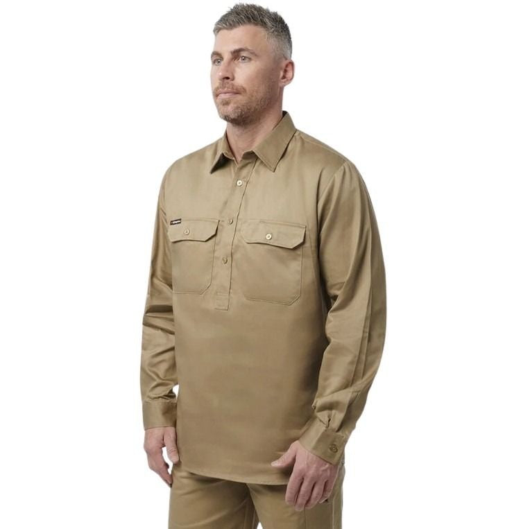 Man wearing a beige long-sleeve shirt on a white background