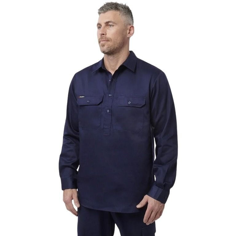 Man wearing a navy long-sleeve shirt on a white background