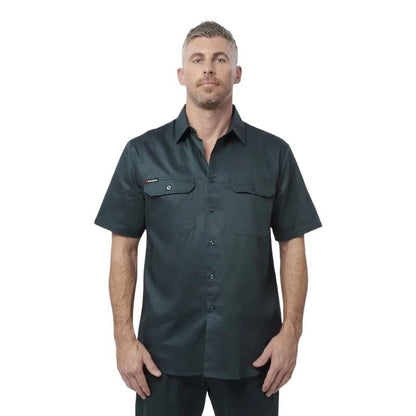 Man wearing a dark green short-sleeve shirt on a white background