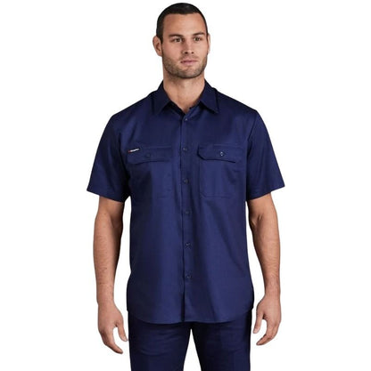 Man wearing a navy blue short-sleeve shirt on a white background