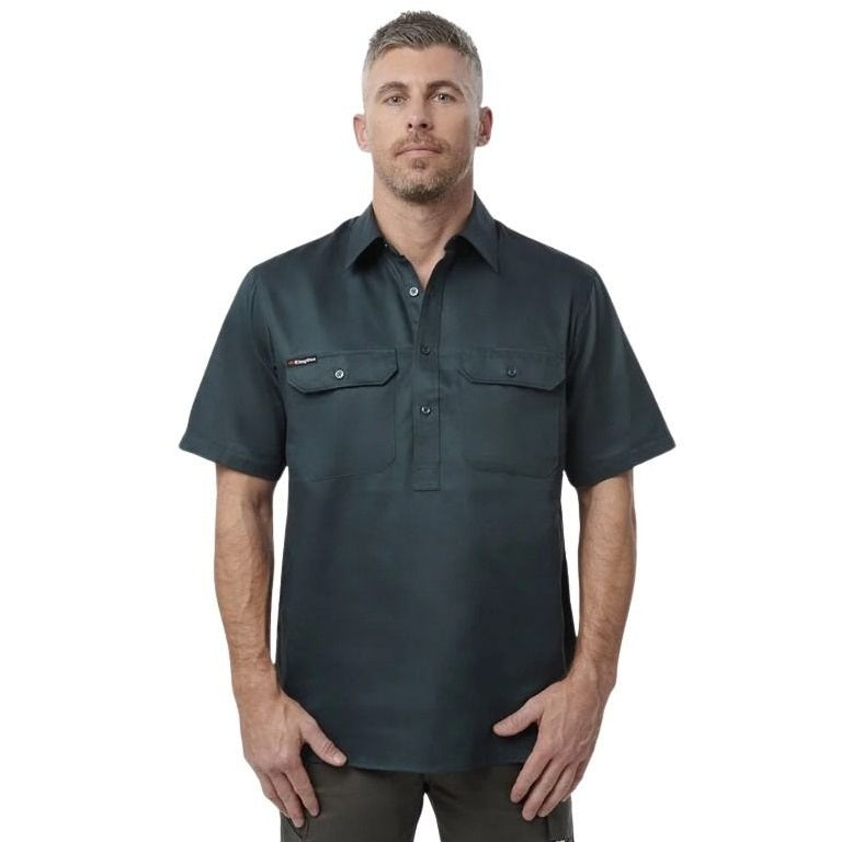 Man wearing a dark green short-sleeve shirt on a white background