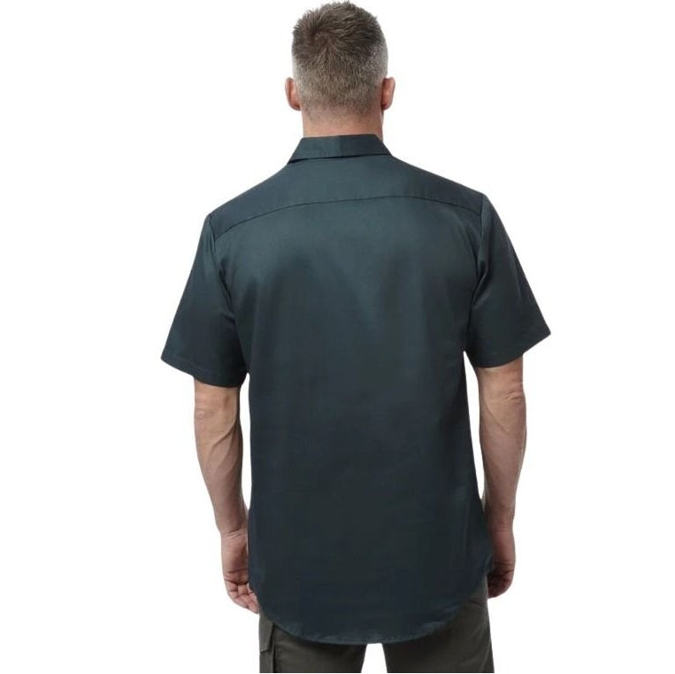 Man wearing a dark green short-sleeve shirt on a white background