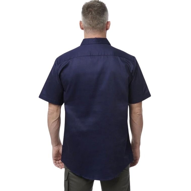Man wearing a navy blue short-sleeve shirt on a white background