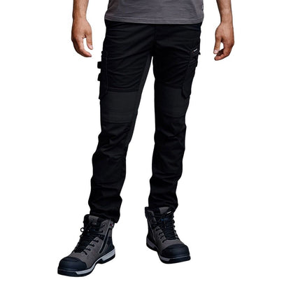 Person wearing black tactical pants and black boots on a white background