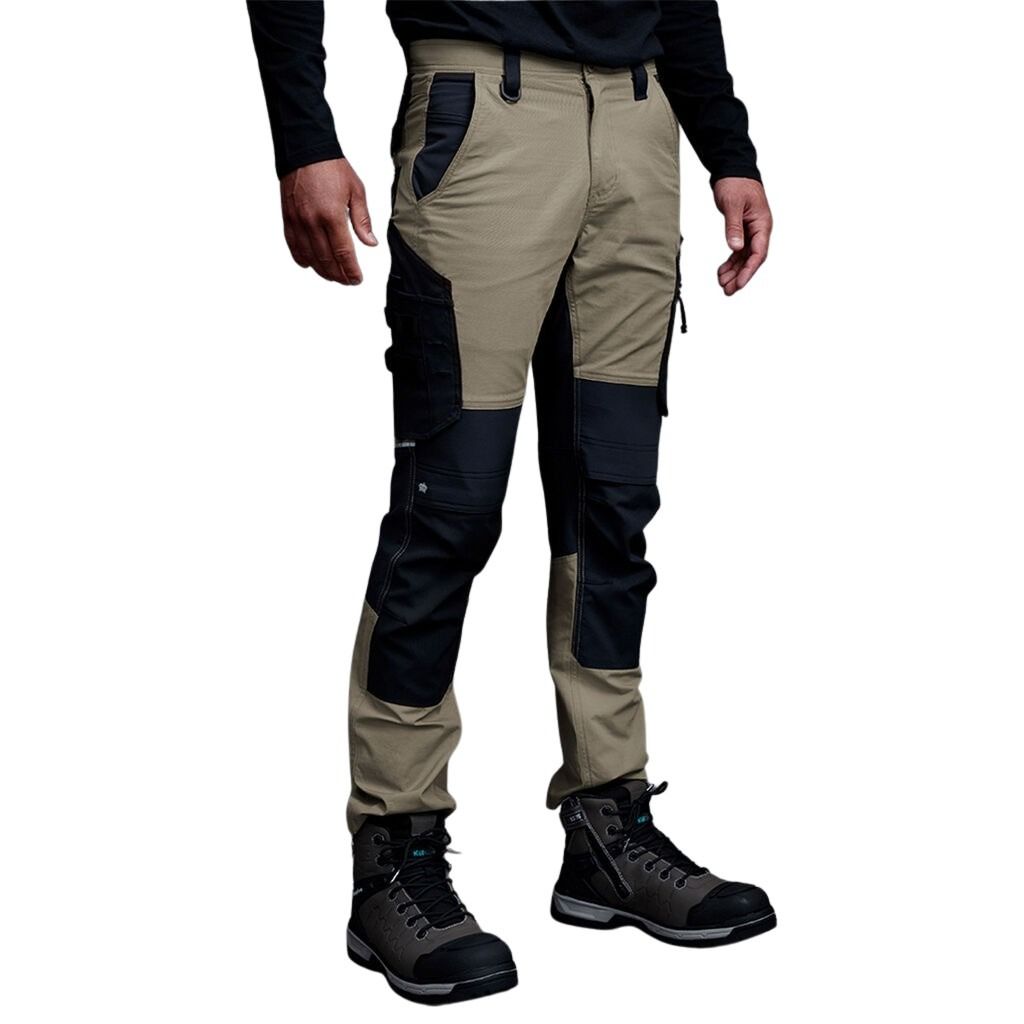 Khaki and black work pants worn by a person on a white background