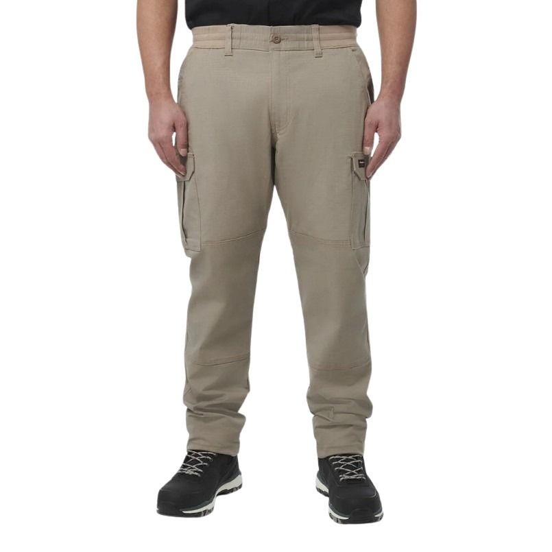 Beige cargo pants worn by a person on a white background
