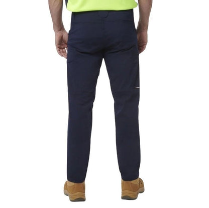 Navy pants worn by a person on a white background