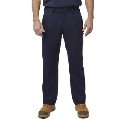 Person wearing navy pants and brown boots on a white background