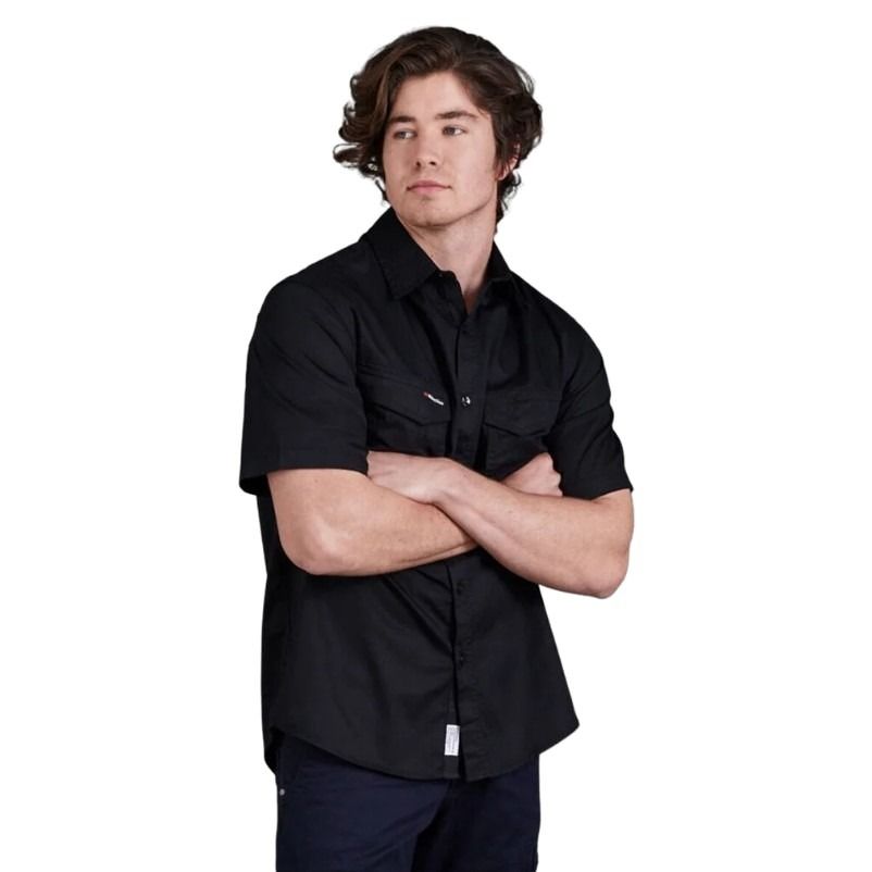 Man wearing a black shirt with arms crossed on a white background