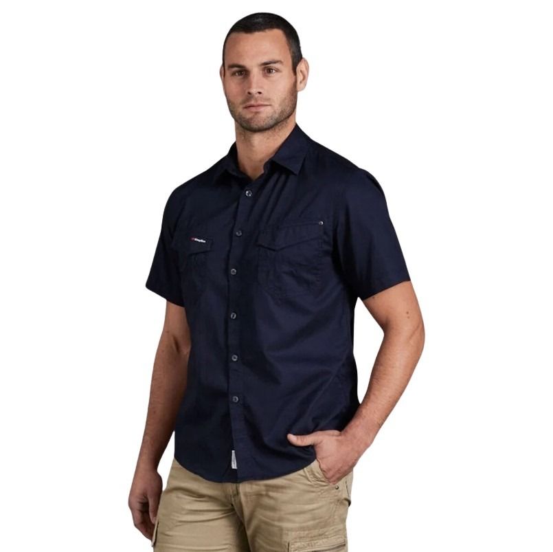 Man wearing a navy short-sleeve shirt on a white background