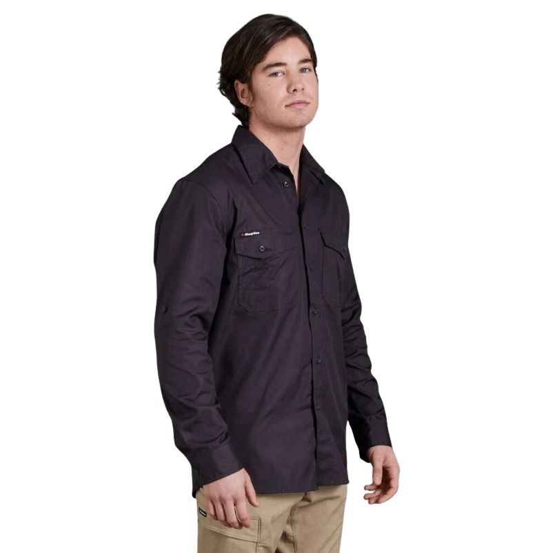Man wearing a black shirt with a logo on a white background