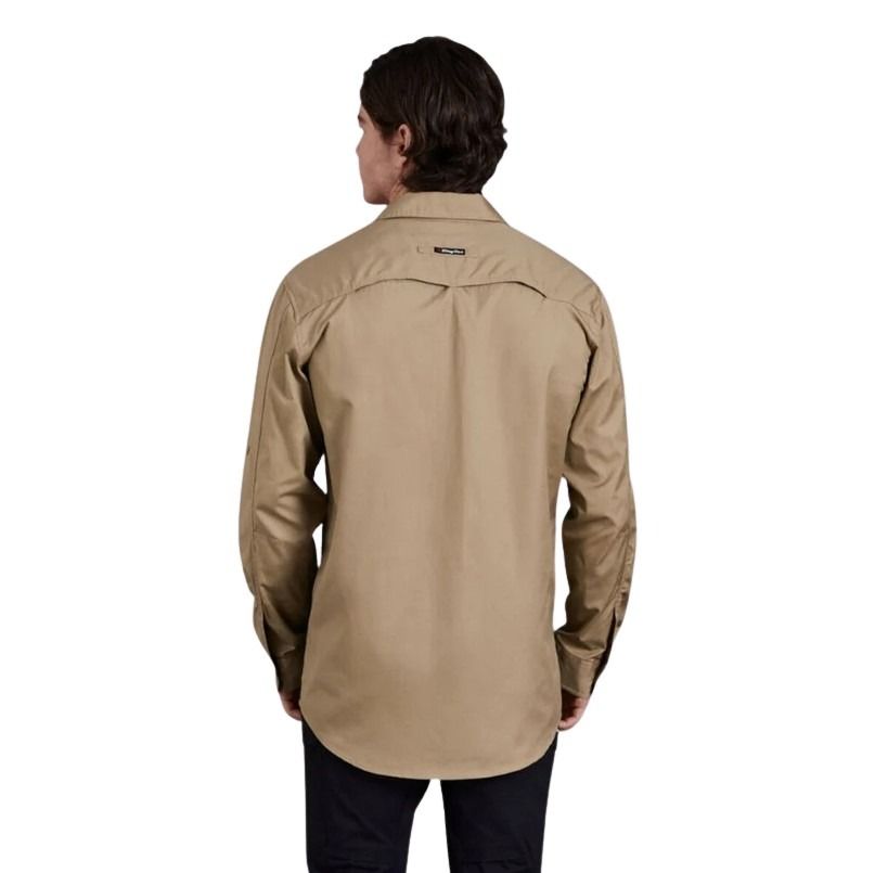 Person wearing a beige shirt on a white background