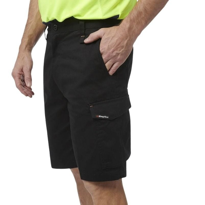 Black cargo shorts worn by a person on a white background