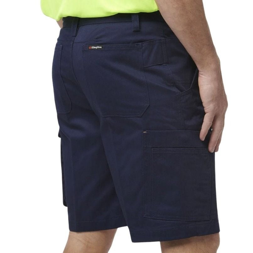 Navy cargo shorts worn by a person on a white background