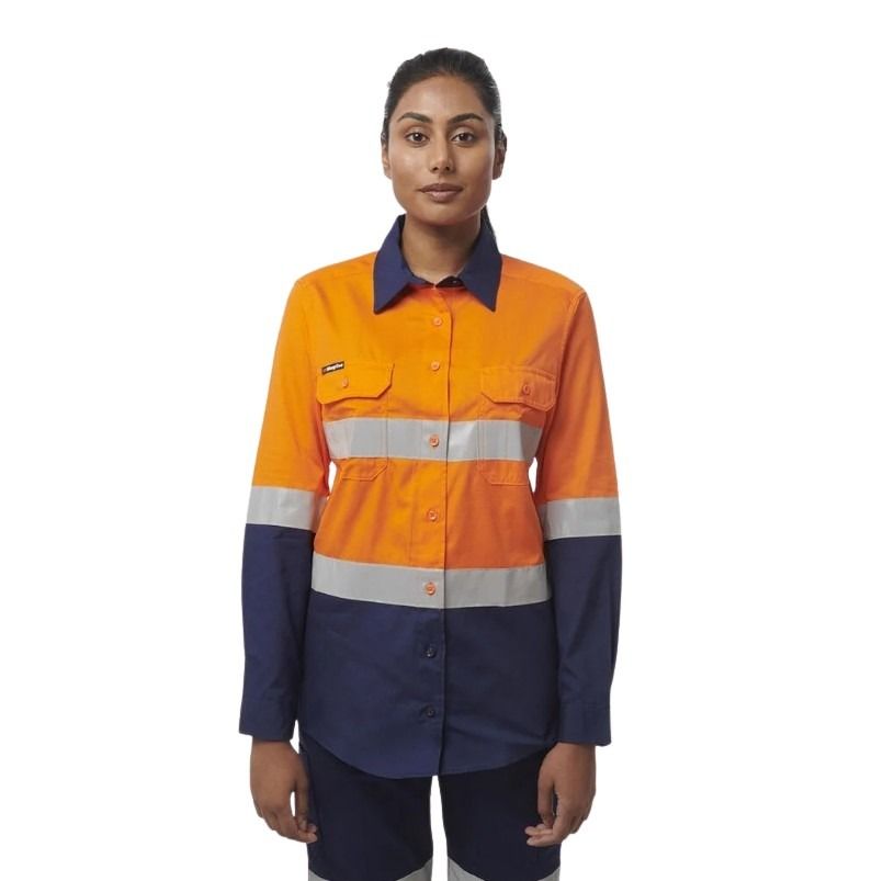 Person wearing an orange and navy work shirt with reflective stripes on a white background
