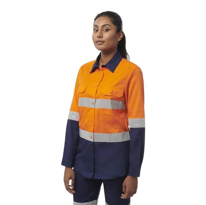 Person wearing an orange and navy high-visibility work shirt on a white background