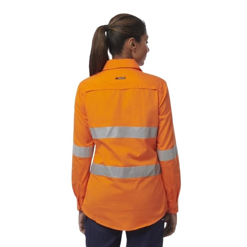 Person wearing an orange high-visibility work shirt on a white background