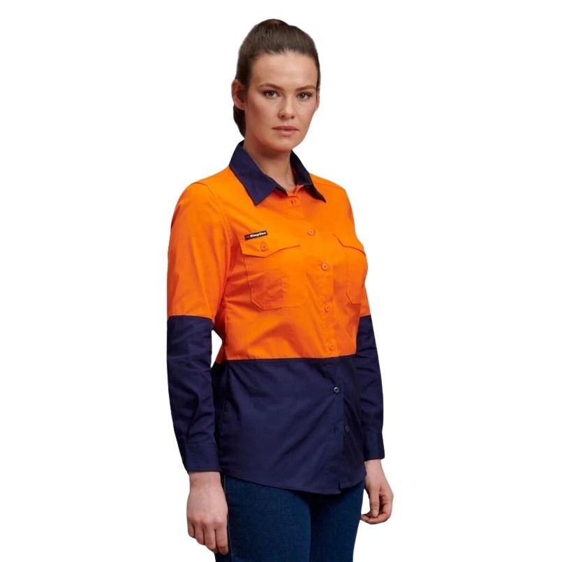 Person wearing a two-tone orange and navy work shirt on a white background