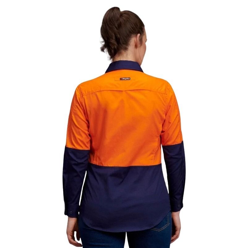 Person wearing an orange and navy work shirt on a white background