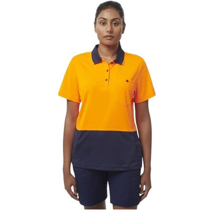 Person wearing a yellow and navy polo shirt with navy shorts on a white background